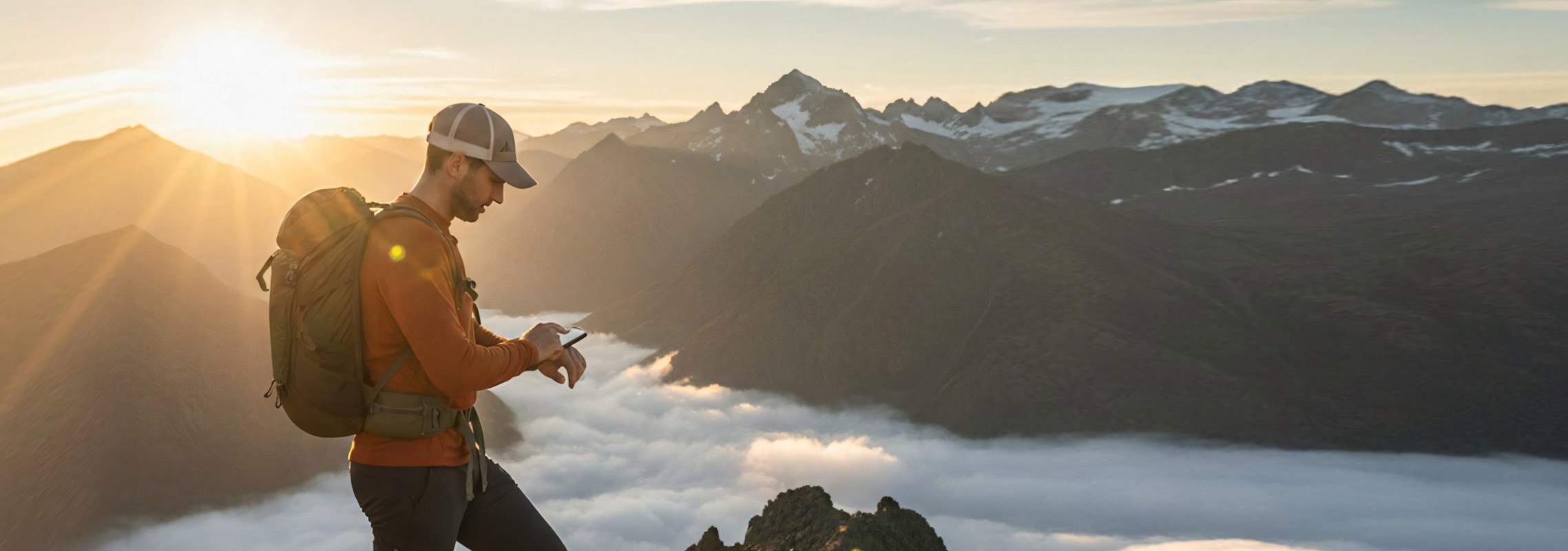 Hiker with backpack on a mountain trail — TripPlanner trip planning app